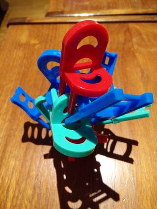 a stacking game made up of small, plastic chairs, the aim of which is to stack chairs until the tower collapses