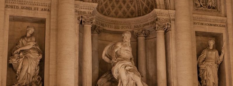 a photograph of the Trevi Fountain, up-close on Neptune in the middle of the sculpture